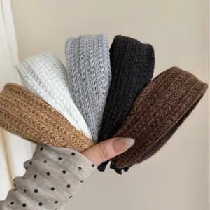Set of five colors of Korean style minimalist wide braided headbands for elegant styling.