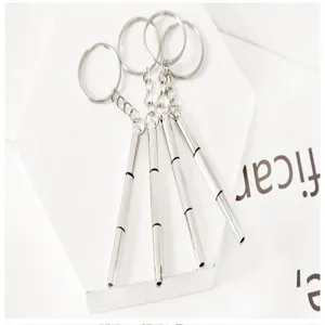 Detail view of portable pocket precision screwdriver set with key ring for glasses repair tool.