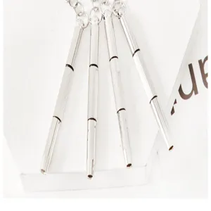 Detail view of portable mini metal screwdriver keychain set for glasses and watch repair tools.