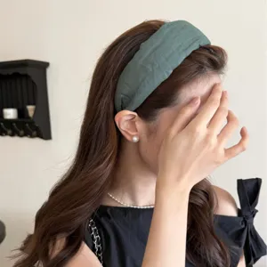 Minimalist green fabric wide headband for women with stylish high cranial top design