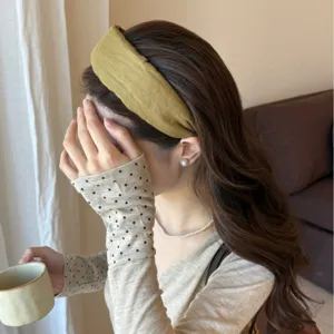 Mustard yellow wide fabric headband for women, minimalist K-style hair hoop accessory.