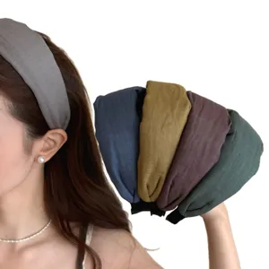 Minimalist fabric wide headband for women shown in multiple solid colors for daily style