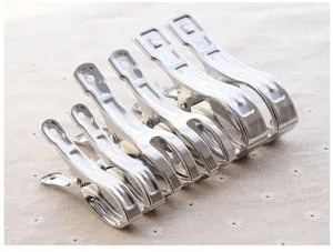 Detailed close-up view of durable stainless steel laundry clips in various sizes for daily use.