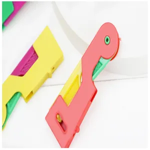 Automatic needle threader for sewing, colorful plastic tool for quick and easy threading.