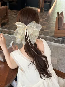 Elegant mesh bow hair claw clip with ink-wash pattern for sweet fairy hairstyles.