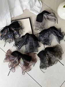 Variety of elegant mesh bow hair clips with polka dots, floral and leopard print designs