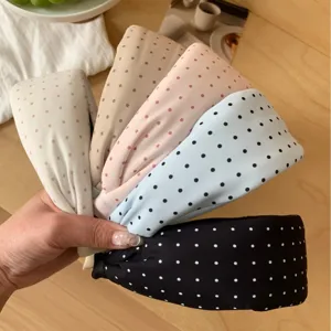 Set of five polka dot wide headbands in assorted pastel and black colors
