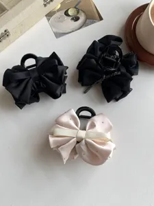 Elegant satin bow hair claws with small rhinestones, featuring three stylish variants.
