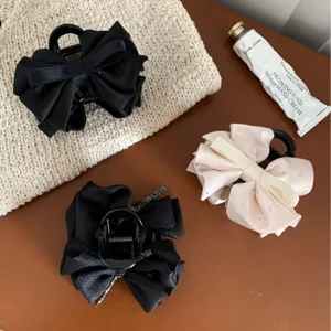 Elegant satin bow hair claw clip with rhinestones for women's half-up hairstyles