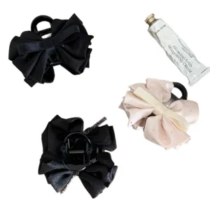 Set of elegant satin bow hair claw clips with rhinestones in black and beige tones
