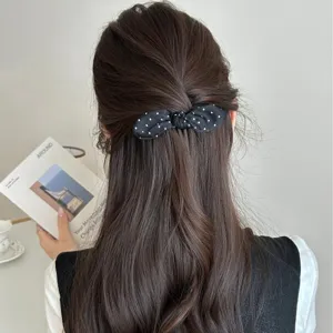 Sweet Korean style black polka dot bow hair comb for elegant back-of-head styling