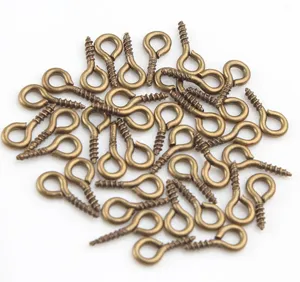 Close-up detail of bronze eye screws for DIY handmade hanging ring craft materials.