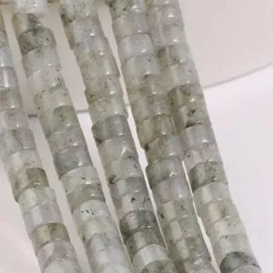 Close-up detail of grey stone rondelle spacer beads for DIY jewelry making and bracelets.