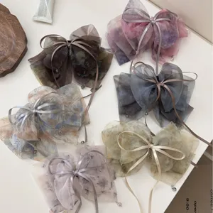 Set of fairy style tie-dye mesh bow hair clips with delicate layered organza design