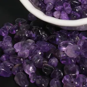 Close-up of purple crystal irregular gravel stones for DIY jewelry, bracelet making, and crafts.