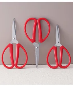 Stainless steel scissors set with red handles, perfect for household, office, and paper cutting tasks.