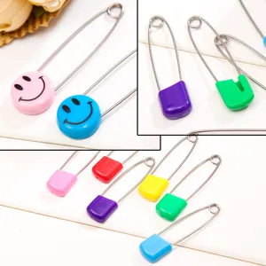 Colorful plastic head safety pins with smiley face designs, safe for baby use and daily pin needs.