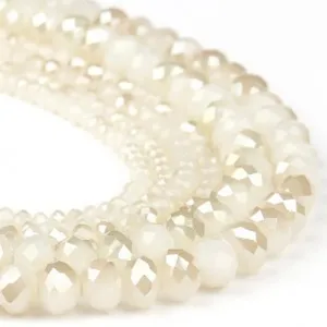 Close-up detail shot of shiny AB color faceted crystal rondelle beads for DIY jewelry.