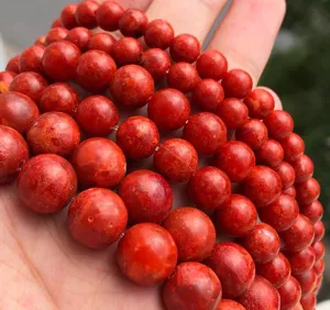 Red coral round loose beads for DIY handmade bracelet jewelry making and crafting accessories.