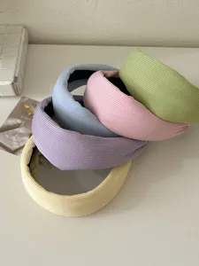 Variety of pastel knitted padded headbands in cream colors for Korean style hair.