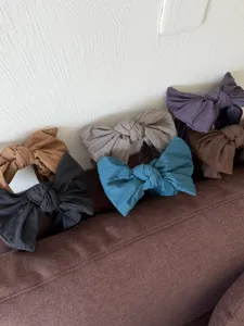 Variété de serre-têtes à gros nœuds unis en tissu texturé pour accessoire de coiffure