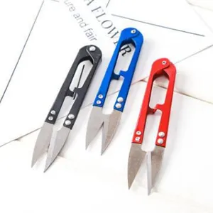 Close-up detail of colorful U-shaped thread scissors, sharp metal blades with spring action.