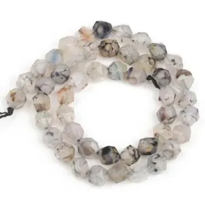 Detailed view of faceted natural stone loose beads for DIY bracelet jewelry crafting.
