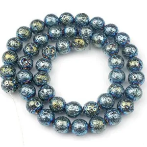 Close-up of blue electroplated lava stone round beads, perfect for DIY jewelry and bracelets.