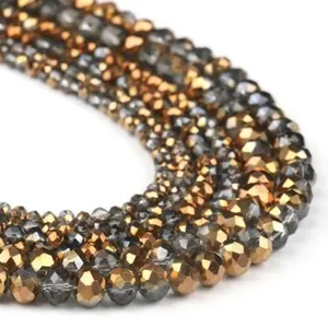 Detailed close-up of faceted crystal rondelle beads in AB gold and grey for DIY jewelry making.