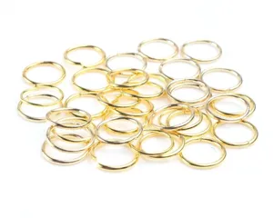 Gold metal jump rings detail shot, ideal for DIY jewelry making, earrings, and beading crafts.