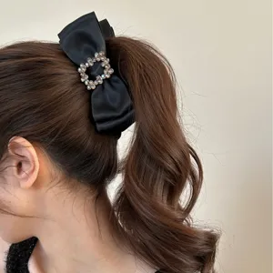 Elegant black satin bow banana clip with rhinestone buckle for stylish ponytail hair