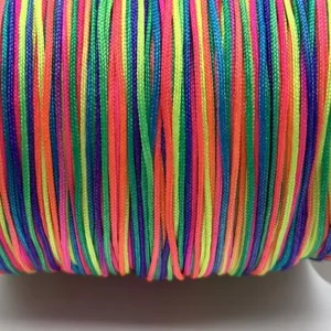 Colorful DIY handmade cord detail close-up showing vibrant neon threads and tightly woven texture.