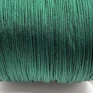 Green braided cord detail shot, perfect for DIY handmade bracelets, necklaces and beading crafts.