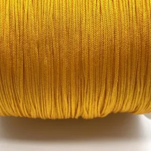 Close-up detail of yellow braided jade cord for DIY handmade jewelry bracelets making