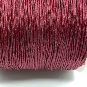 Detailed close-up view of dark brown craft cord, showing neat texture for DIY bracelets.