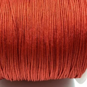 Close-up detail of copper-brown braided cord, smooth texture for DIY jewelry making.