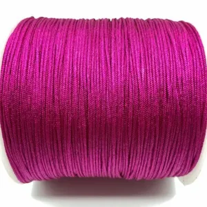 Close-up detail of magenta craft cord roll, perfect for DIY handmade bracelet and necklace stringing.