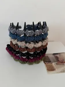 Detailed view of vintage yarn-wrapped wavy headbands with non-slip teeth in assorted colors
