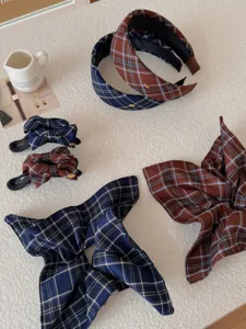 Close-up of vintage plaid hair accessories including headbands, clips and scrunchies.