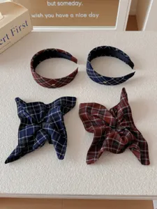 Detailed view of preppy style plaid headbands and matching bow hair scrunchies