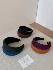 Collection of ribbed wide headbands in assorted colors for high cranial top look.