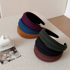 Set of minimalist wide ribbed headbands in various autumn colors for a high-cranial top effect