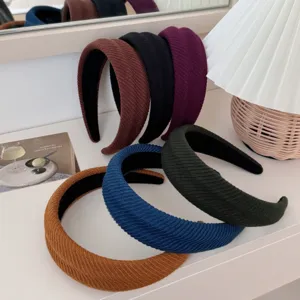 Stylish ribbed padded headbands in various solid colors for a high skull top look.