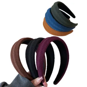 Set of solid color ribbed wide-side headbands designed for high top knot hair styling