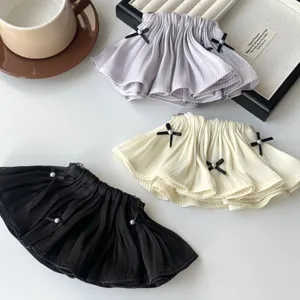 Elegant pleated ruffle hair clips with black bows and pearls, available in three colors