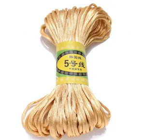 Close-up detail of golden Korean craft cord, ideal for Chinese knotting and DIY weaving.