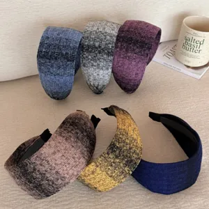 Collection of six textured wide knit headbands in various colors for a stylish vintage look.