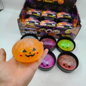 Detailed view of an orange pumpkin-faced Halloween squishy toy for stress relief and fun