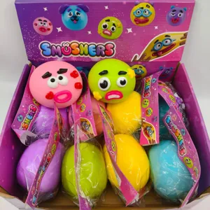 Detail view of Smushers squishy toys with funny dog faces in a colorful retail display box