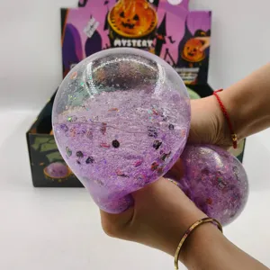 Detail showing the purple glittery jelly texture of the giant Halloween stress toy.